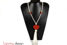 Necklace designed with red lotus pendants, white tassel